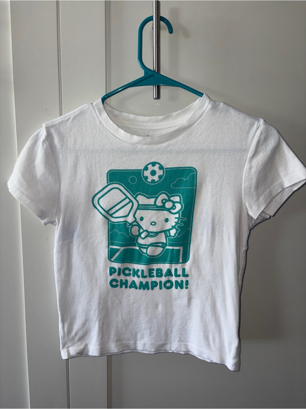 Hello Kitty White Baby Tee with Teal Pickleball Graphic
